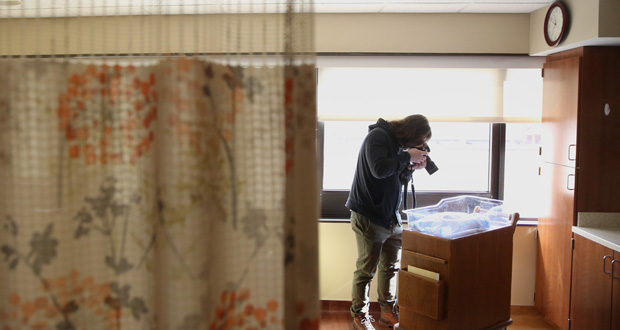 There are tears and more tears. But his photography can hopefully help grieving parents. Photo / The Washington Post by Timothy Taii